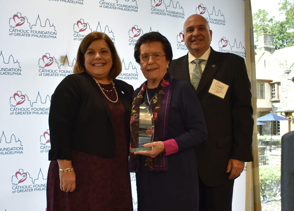 Dr. Rosalie M. Mirenda receiving her Women in Philanthropy award