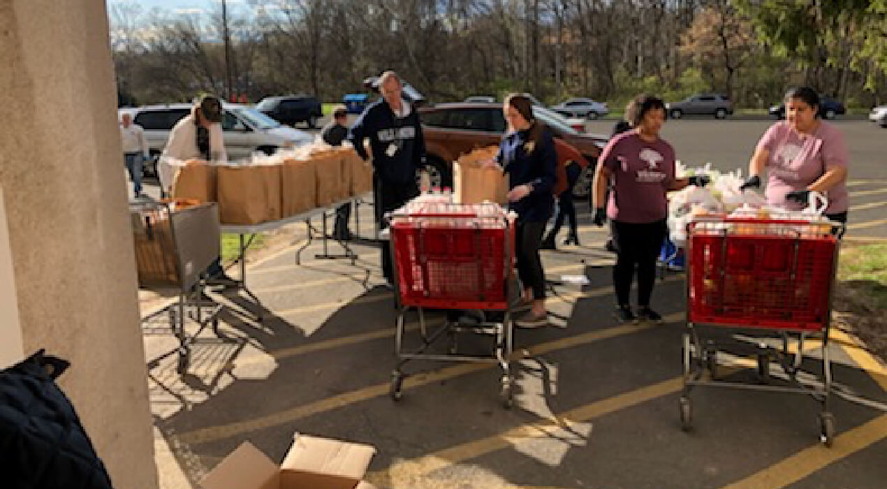 Loading up carts of food at the Montgomery County Family Service Center