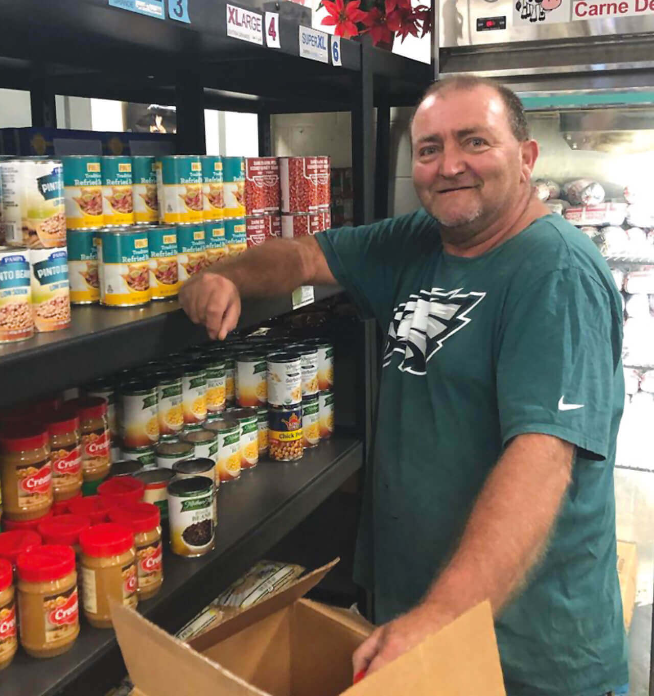 Man getting food from the food pantry
