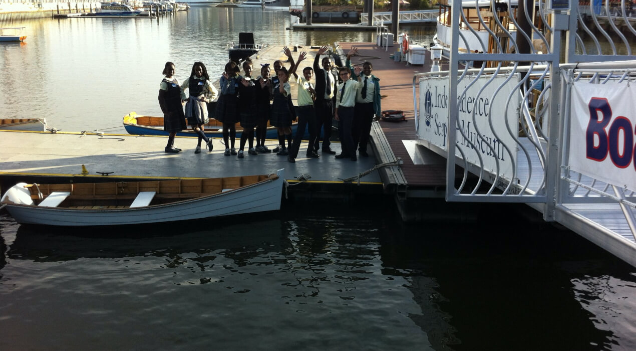 Students from St. Francis de Sales School out on a dock by the water